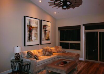 A living room with a ceiling fan.